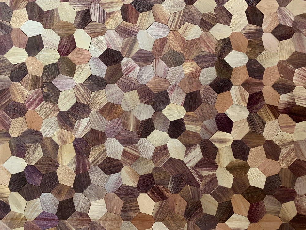 a close up of a rug made of wood