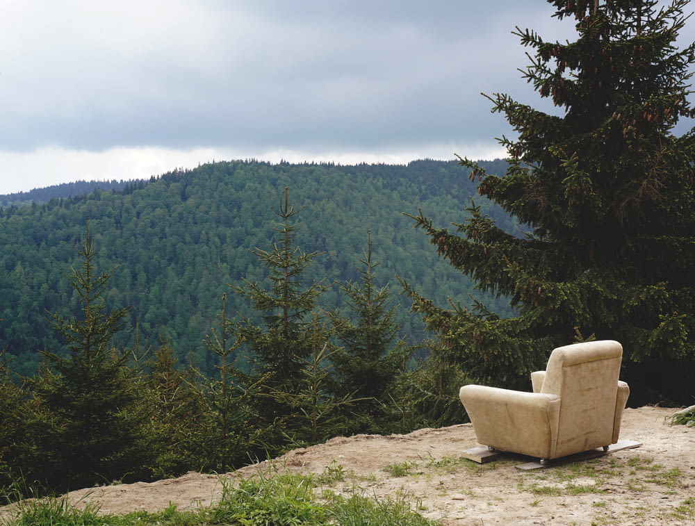gray fabric sofa armchair in mountain during daytime