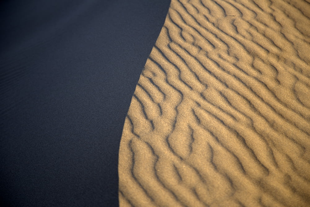 a sand dune in the middle of a desert