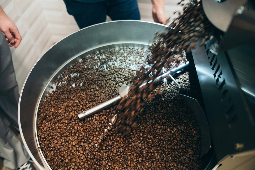 pouring coffee beans in bowl