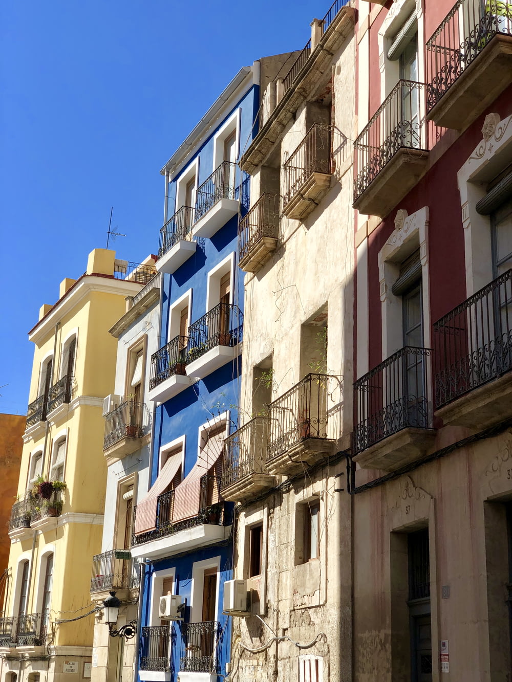 five assorted-color concrete buildings