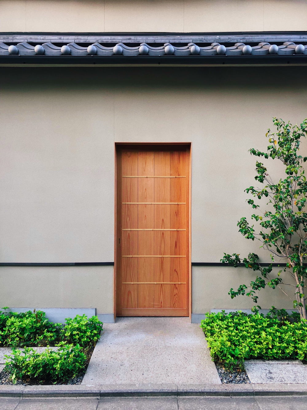 brown wooden door is close during daytime