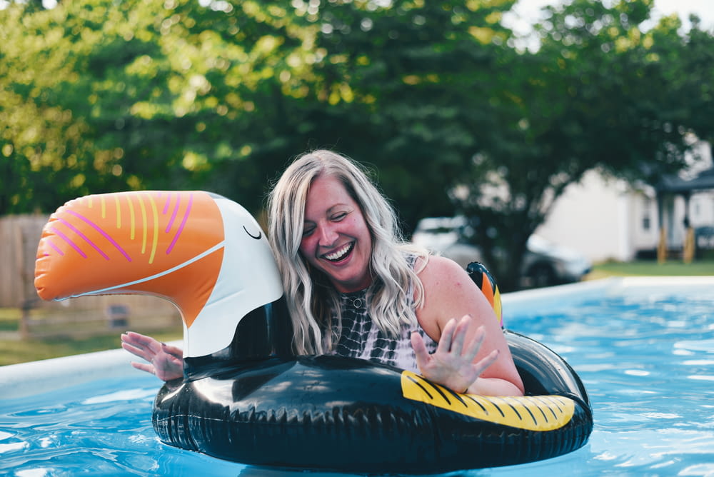 smiling woman on inflatable raft