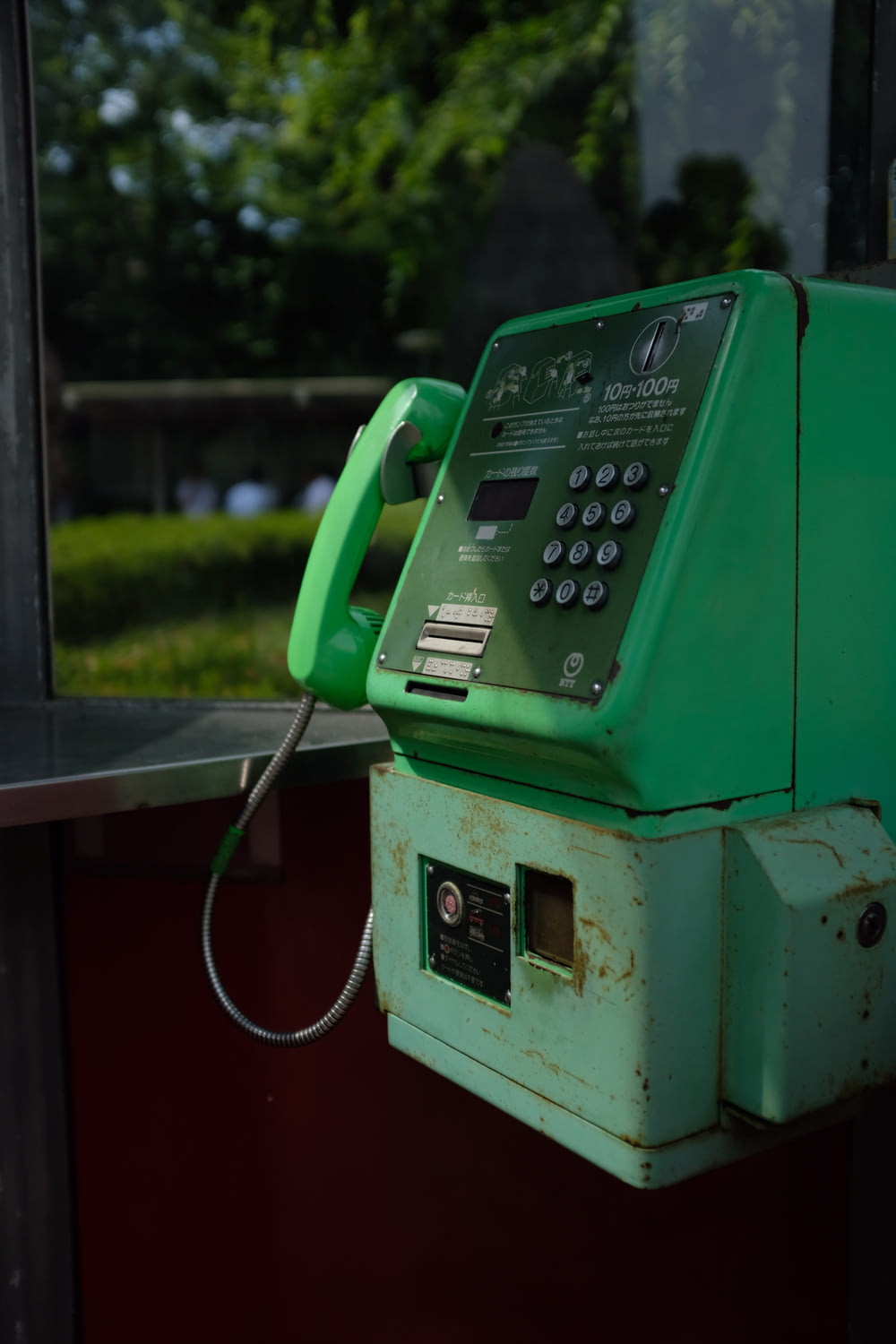 green coin operated telephone