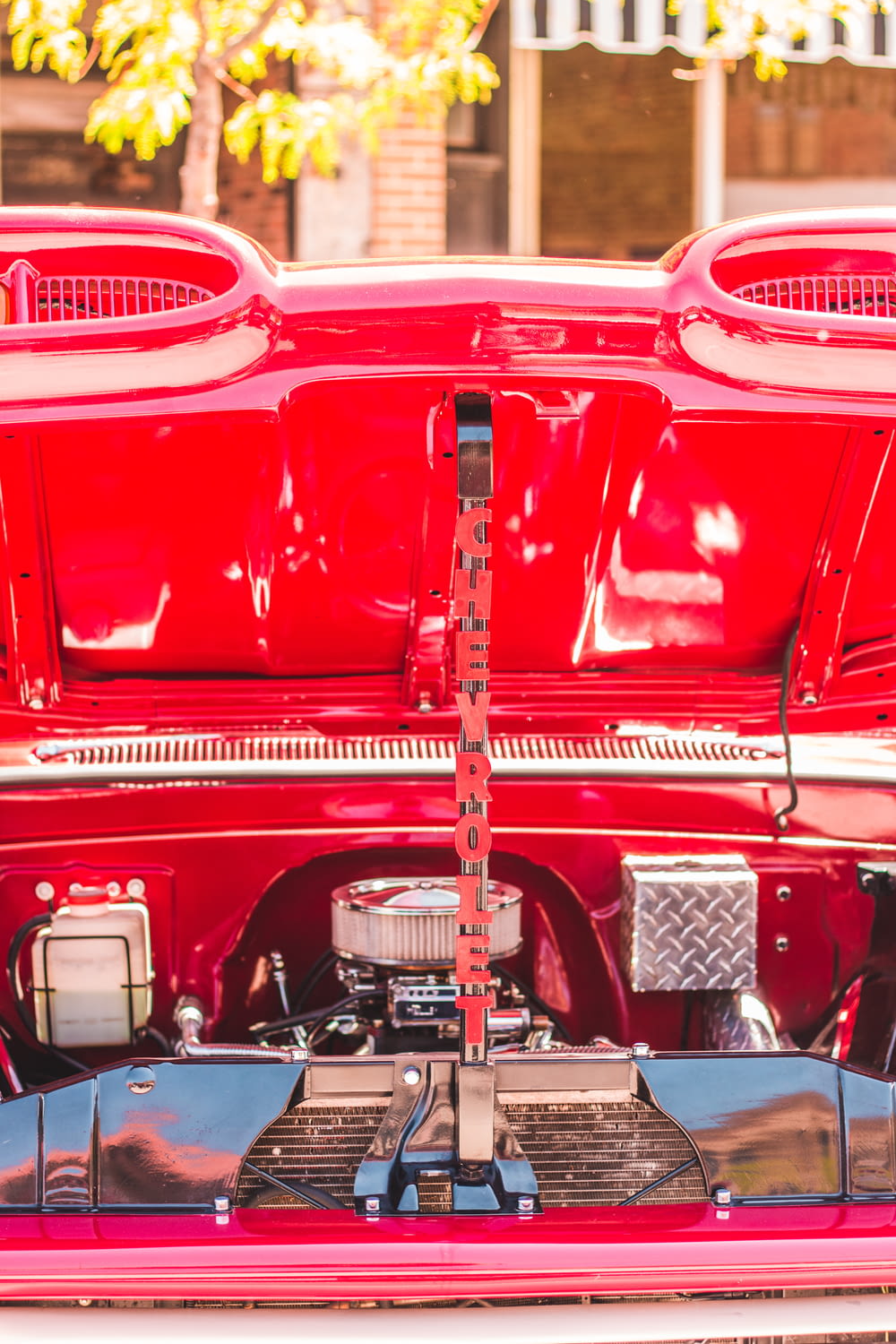 a close up of the rear end of a red car