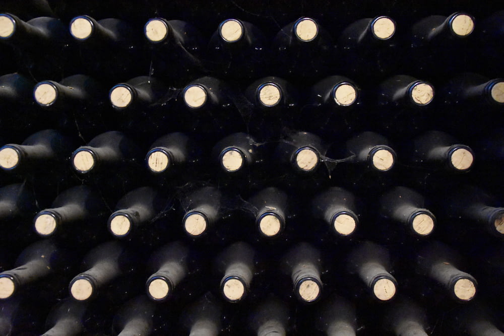 a close up of a bunch of wine bottles