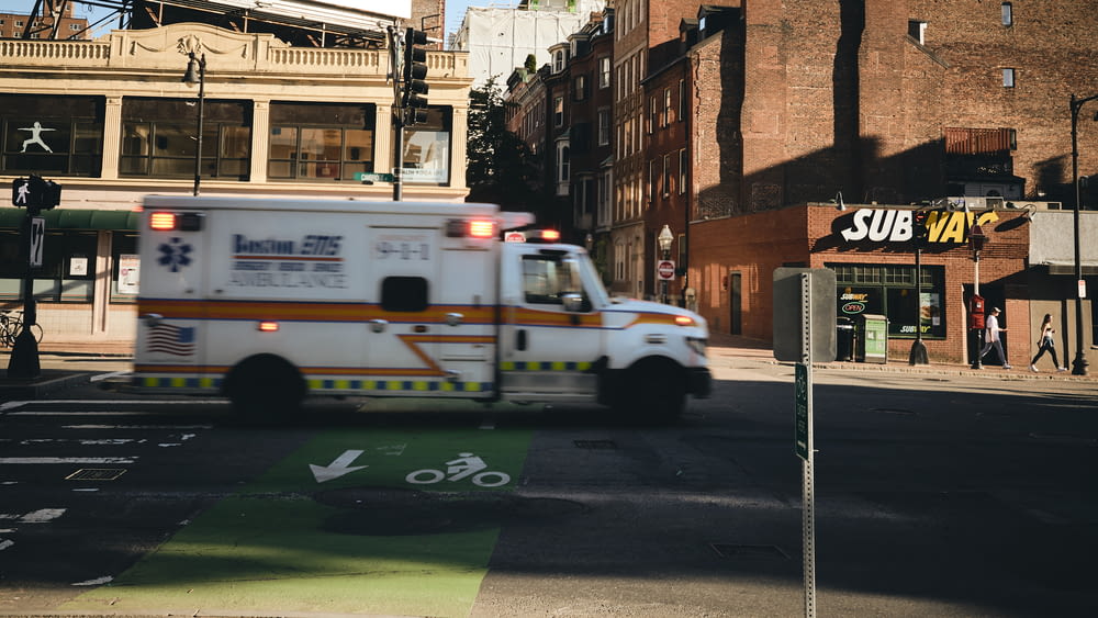 white ambulance near building
