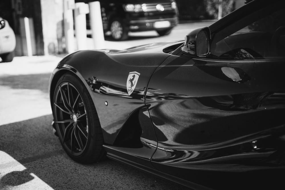 grayscale photography of Ferrari coupe