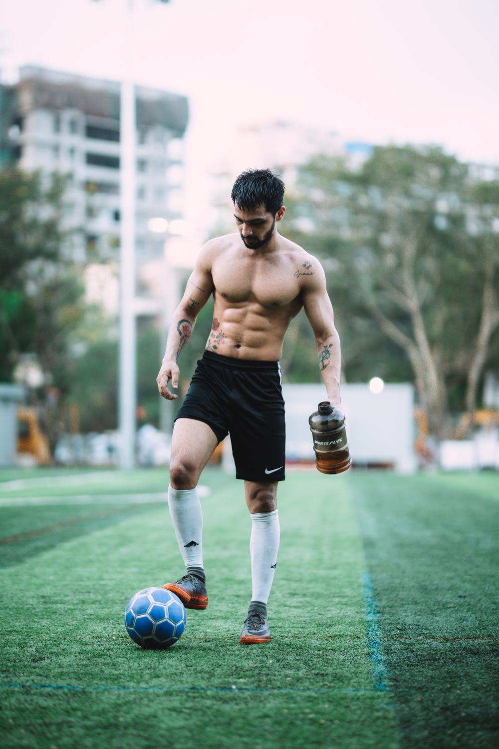 man playing soccer ball during daytime