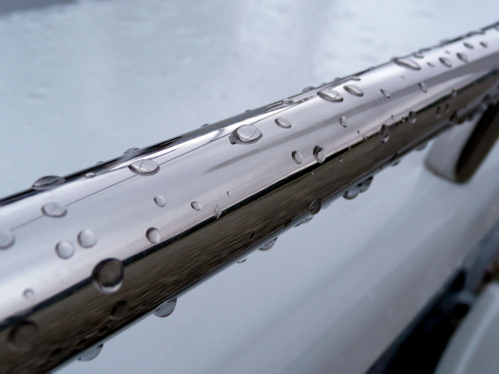 a close up of a car with water drops on it