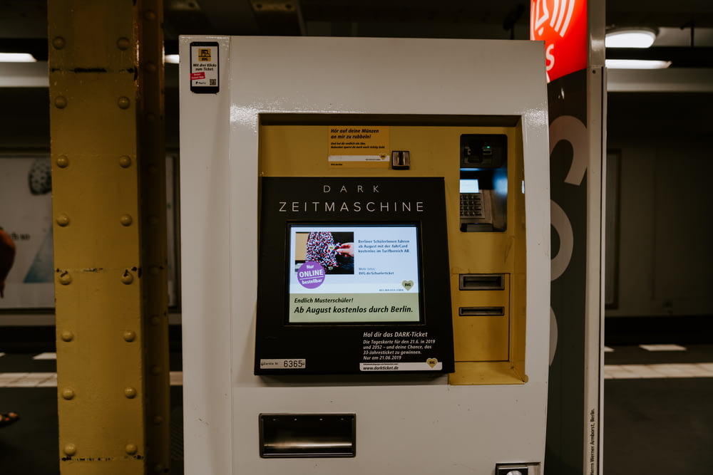 a vending machine for dark zeitmacchine in a parking garage