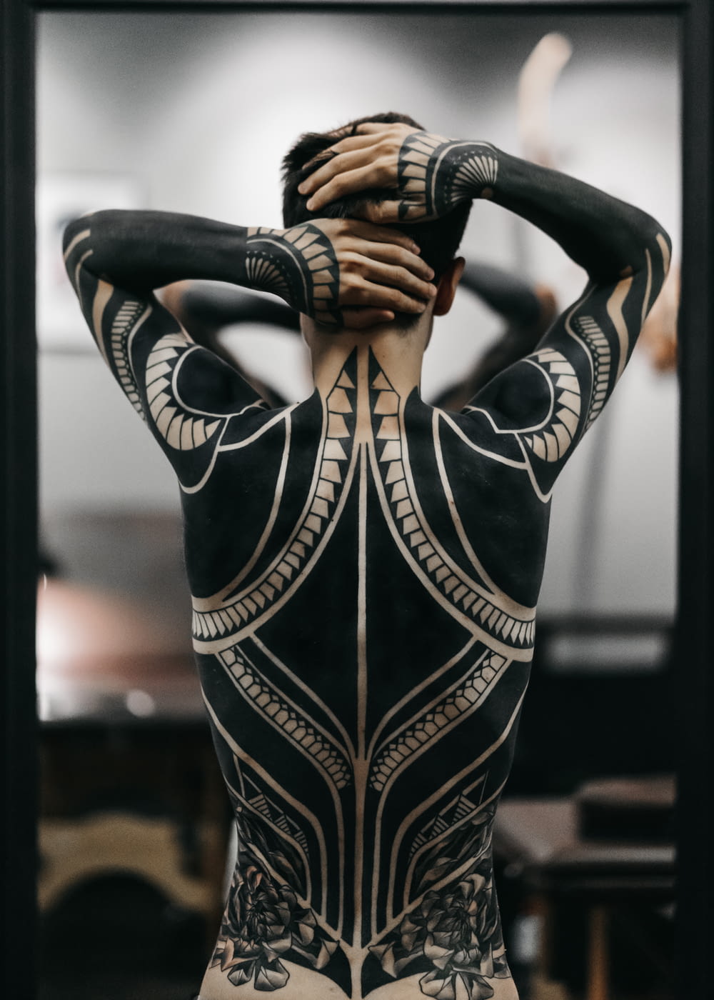 person wearing full body tattoo art