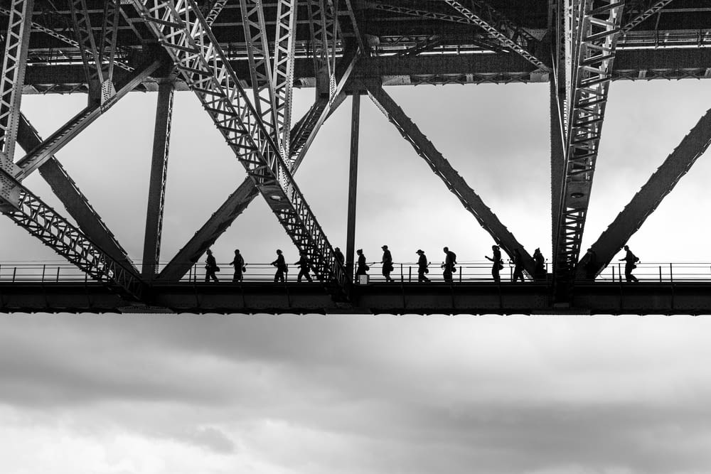 people walking on bridge