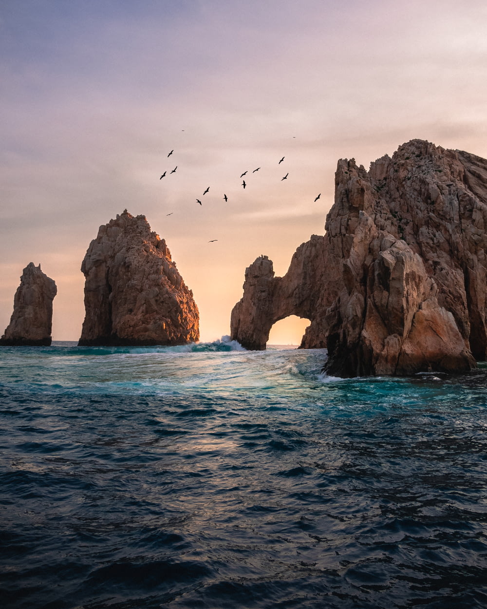 rock formation on the ocean photography