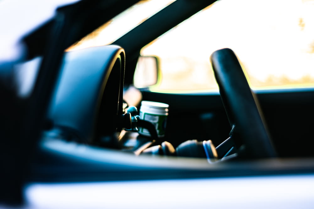 black vehicle steering wheel close-up photography