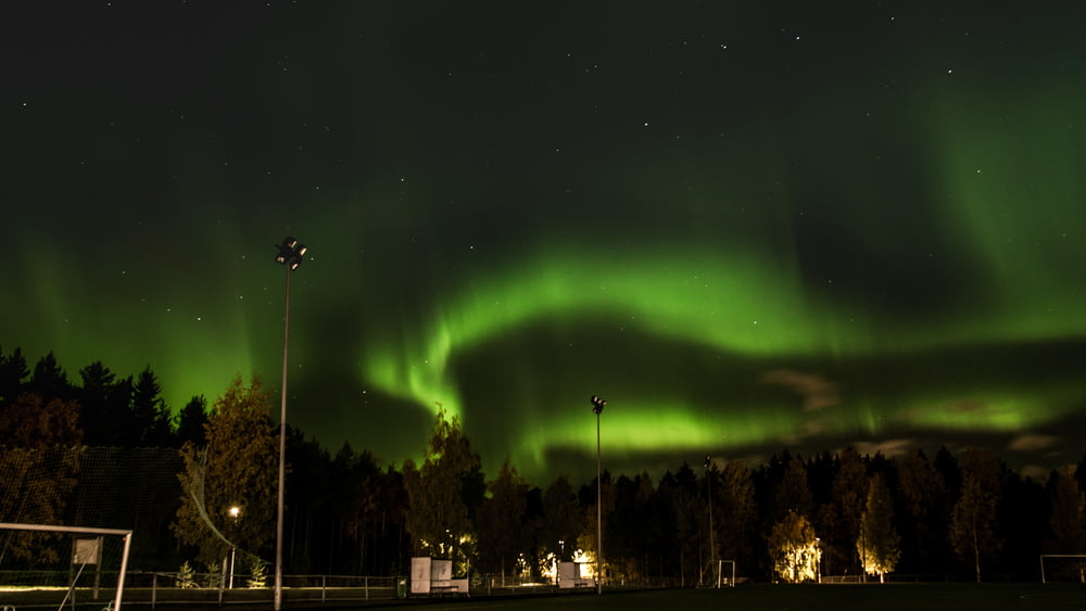 a large green aurora bore in the night sky