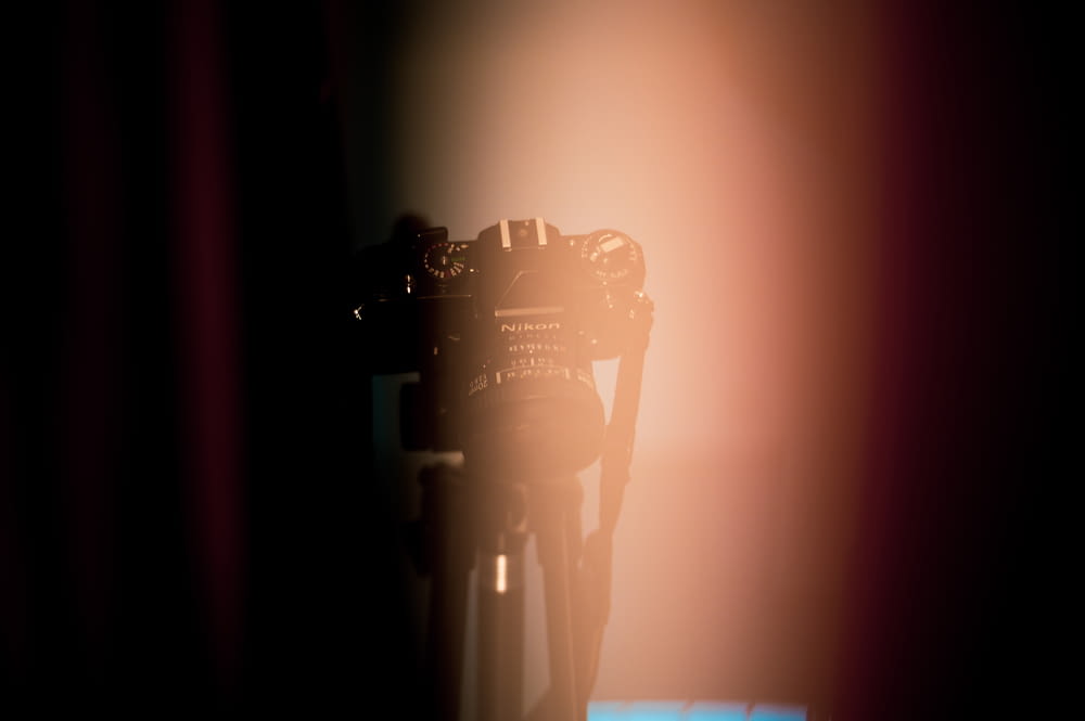 photo of black DSLR camera