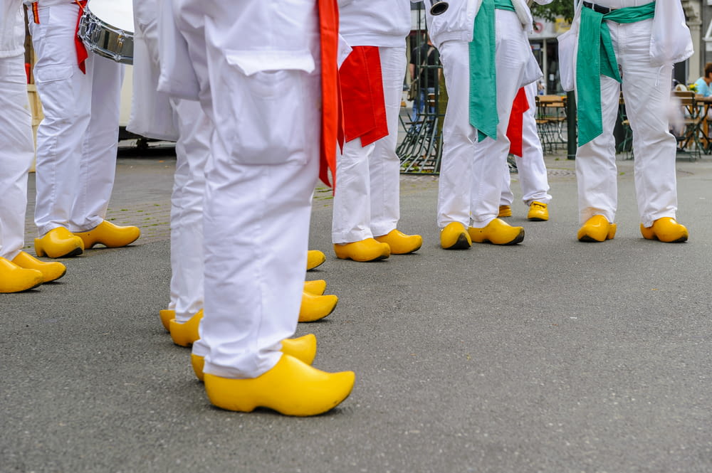 people wearing yellow leather shoes