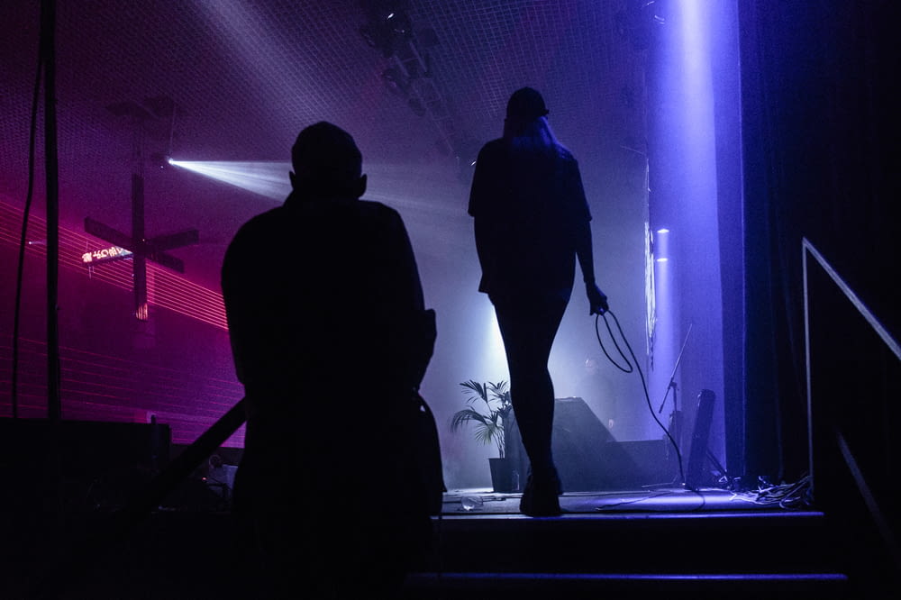 silhouette of person standing on stage