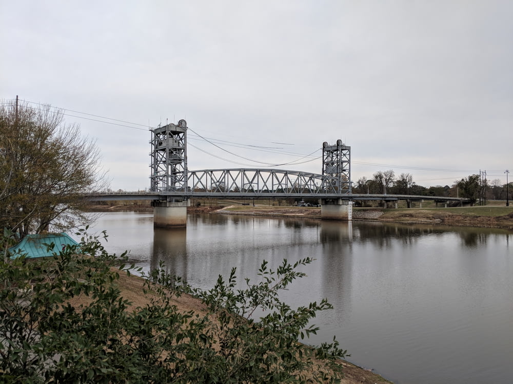 gray metal bridge over water