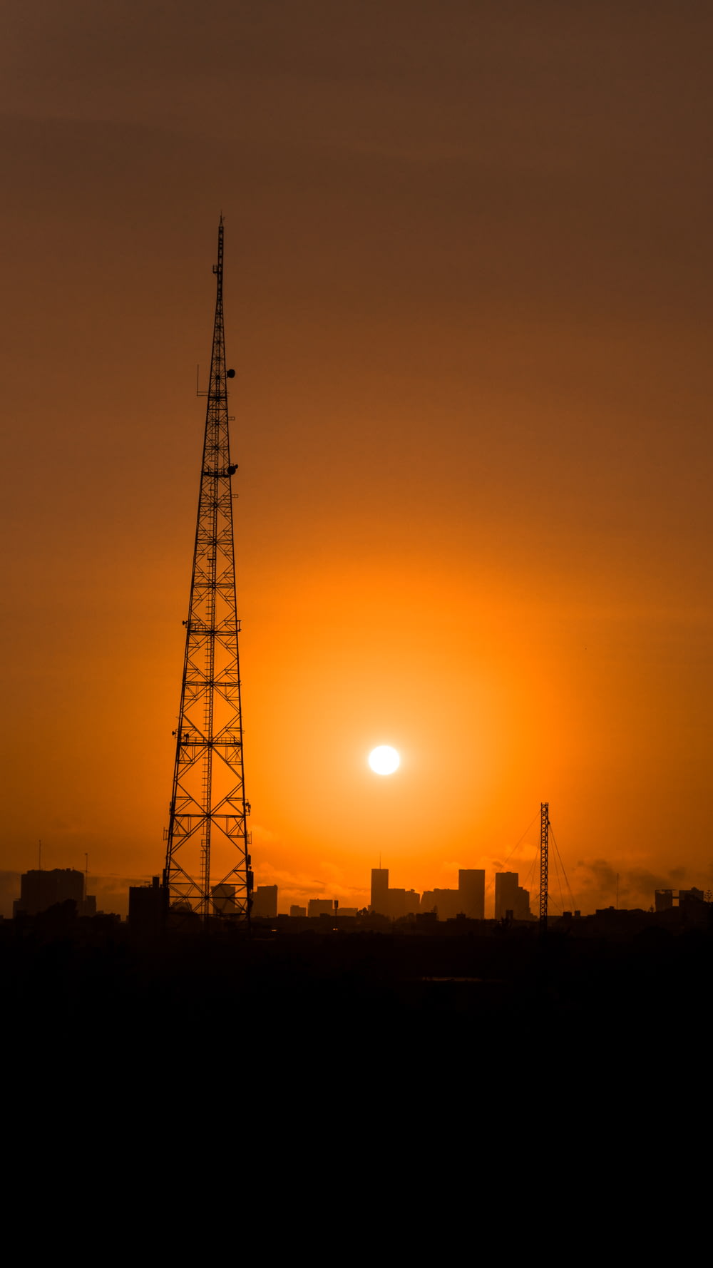silhouette of metal tower during golden hour