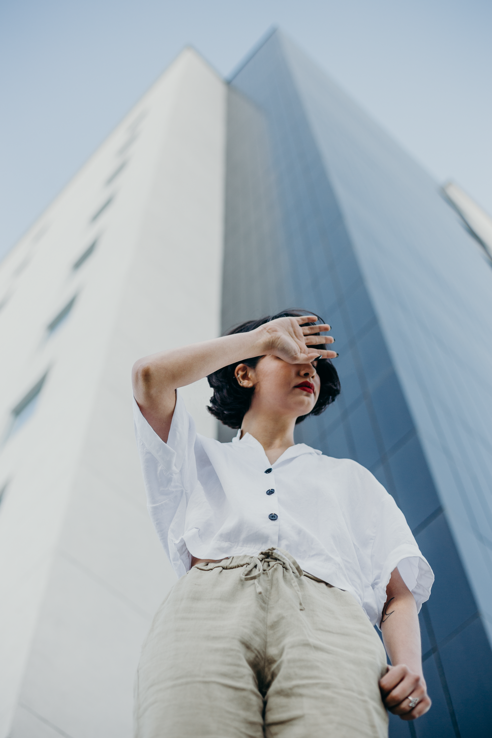 woman standing near high-rise buildings