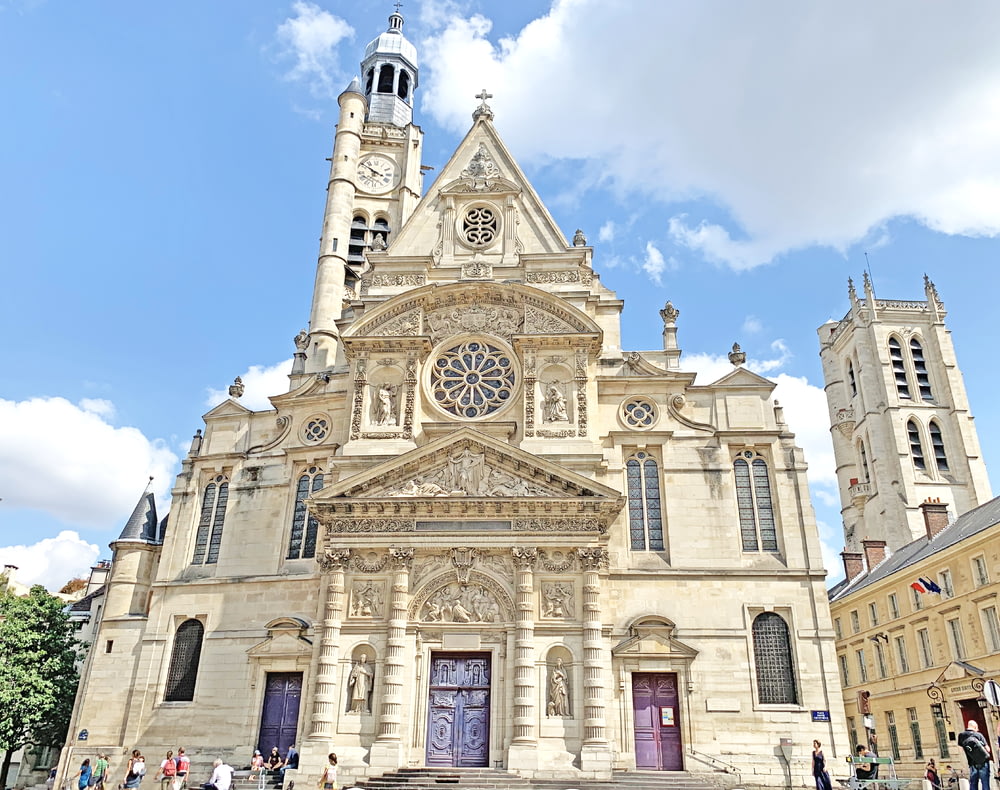 people walking near Saint Etienne Du Mont church in Paris France