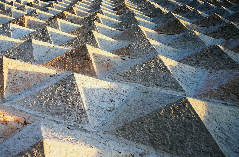 gray cement small pyramids surface