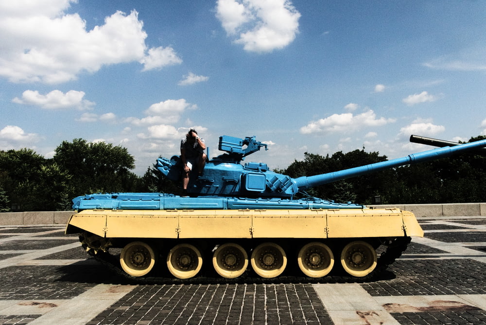 person sitting on tank