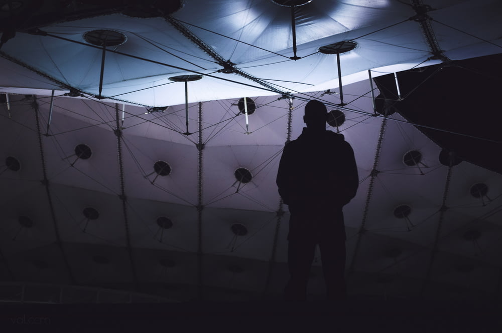 silhouette of man inside studio