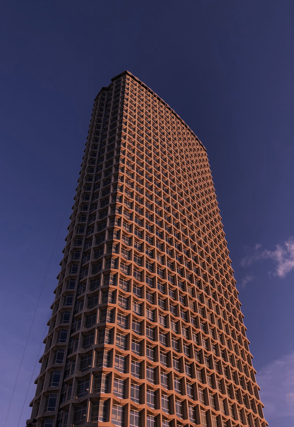 a very tall building with many windows on top of it