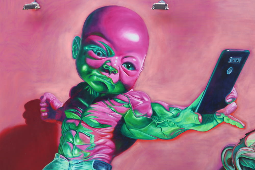 green and urple baby holding smartphone painting