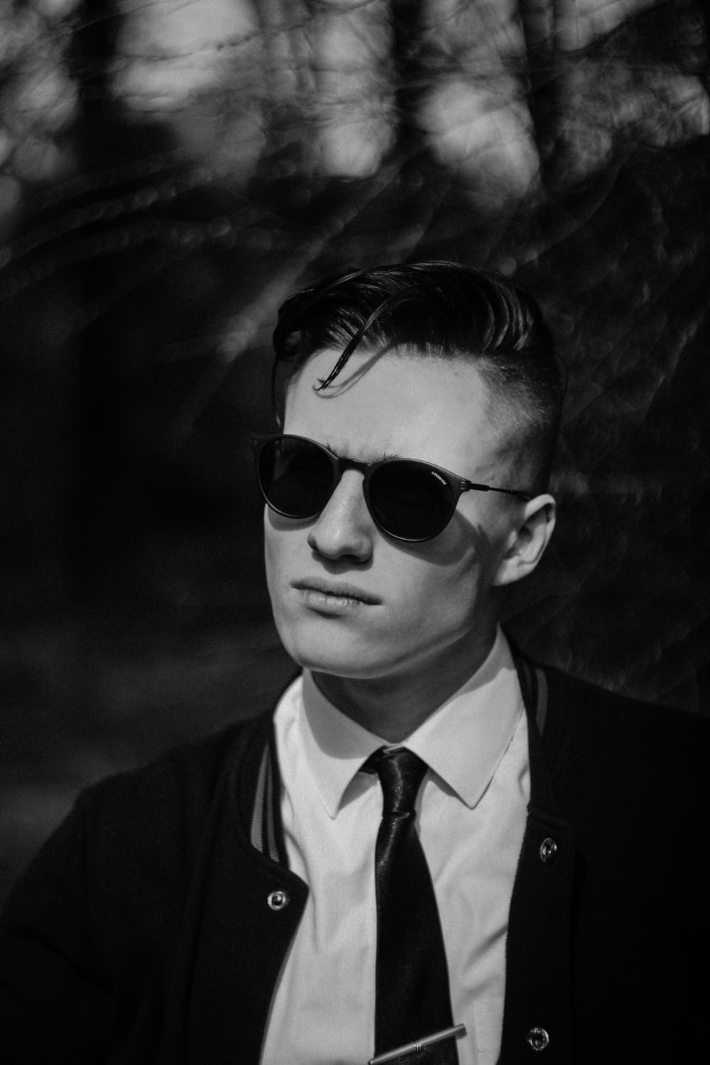 man wears black frame sunglasses