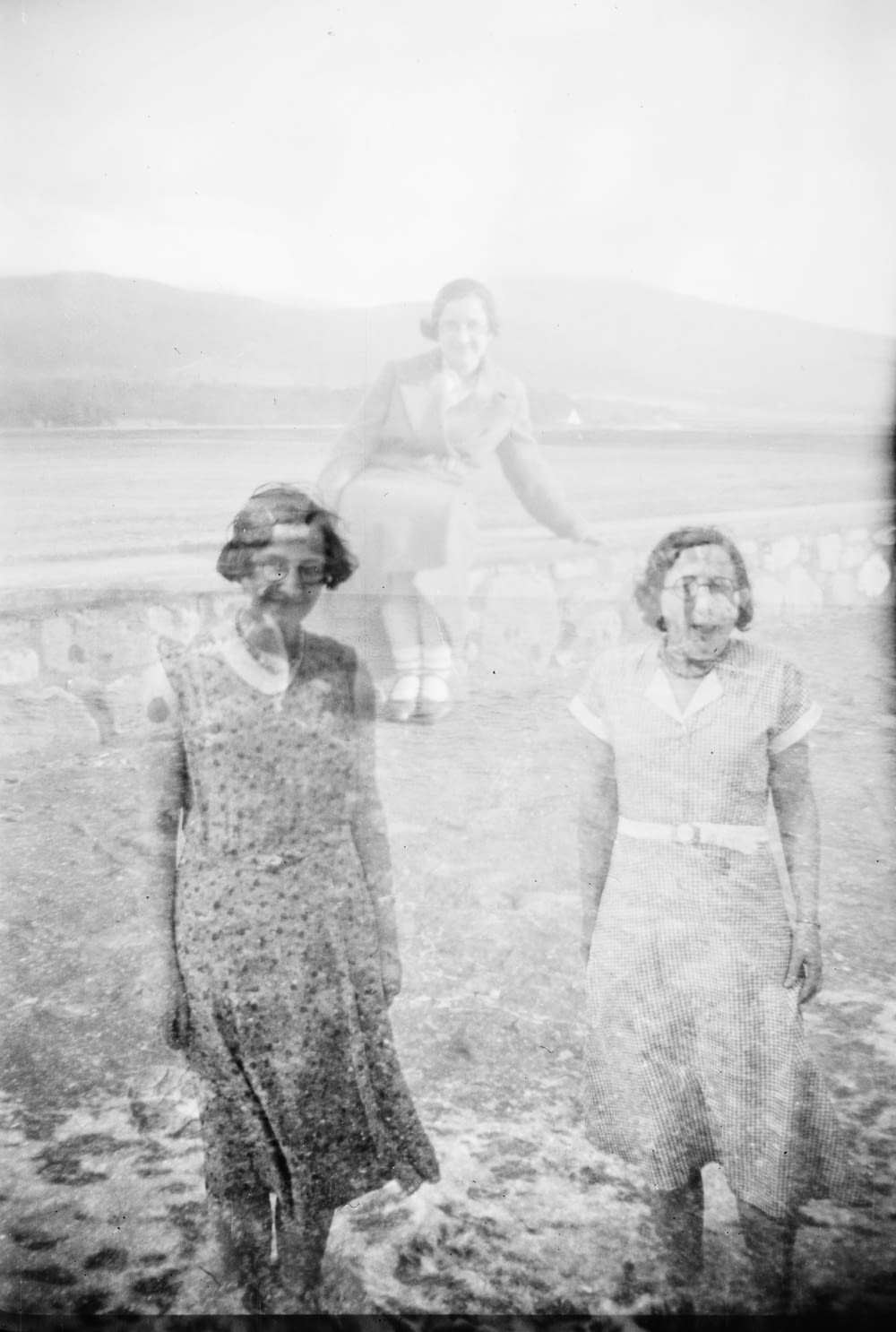 grayscale photo of three women