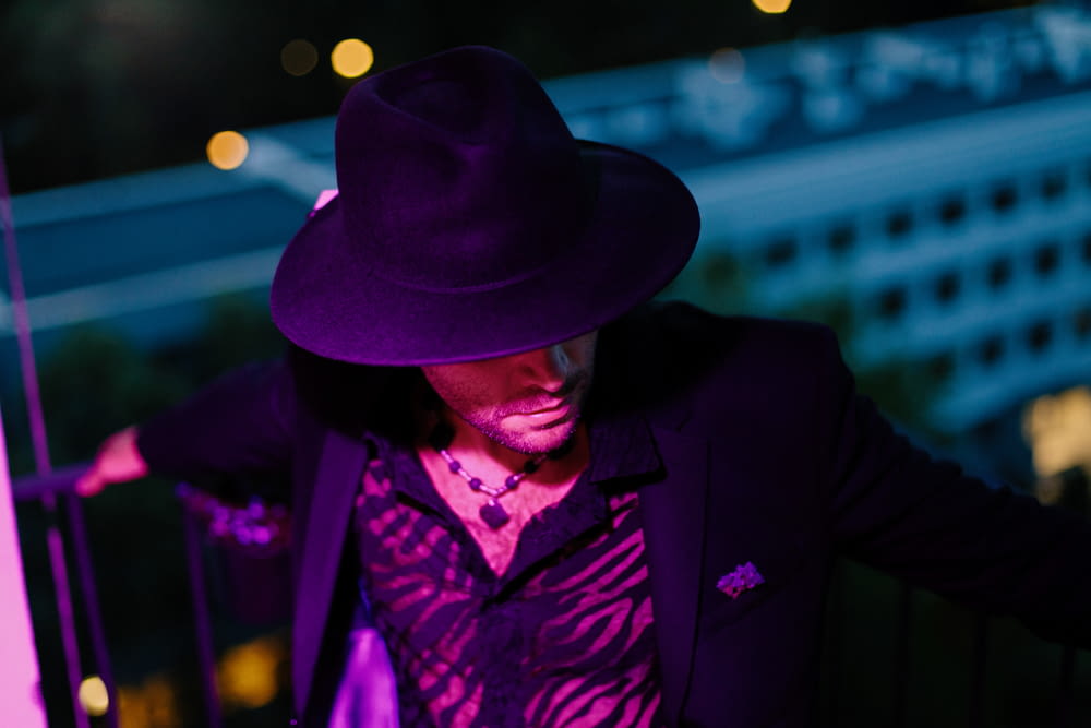 man wearing purple hat