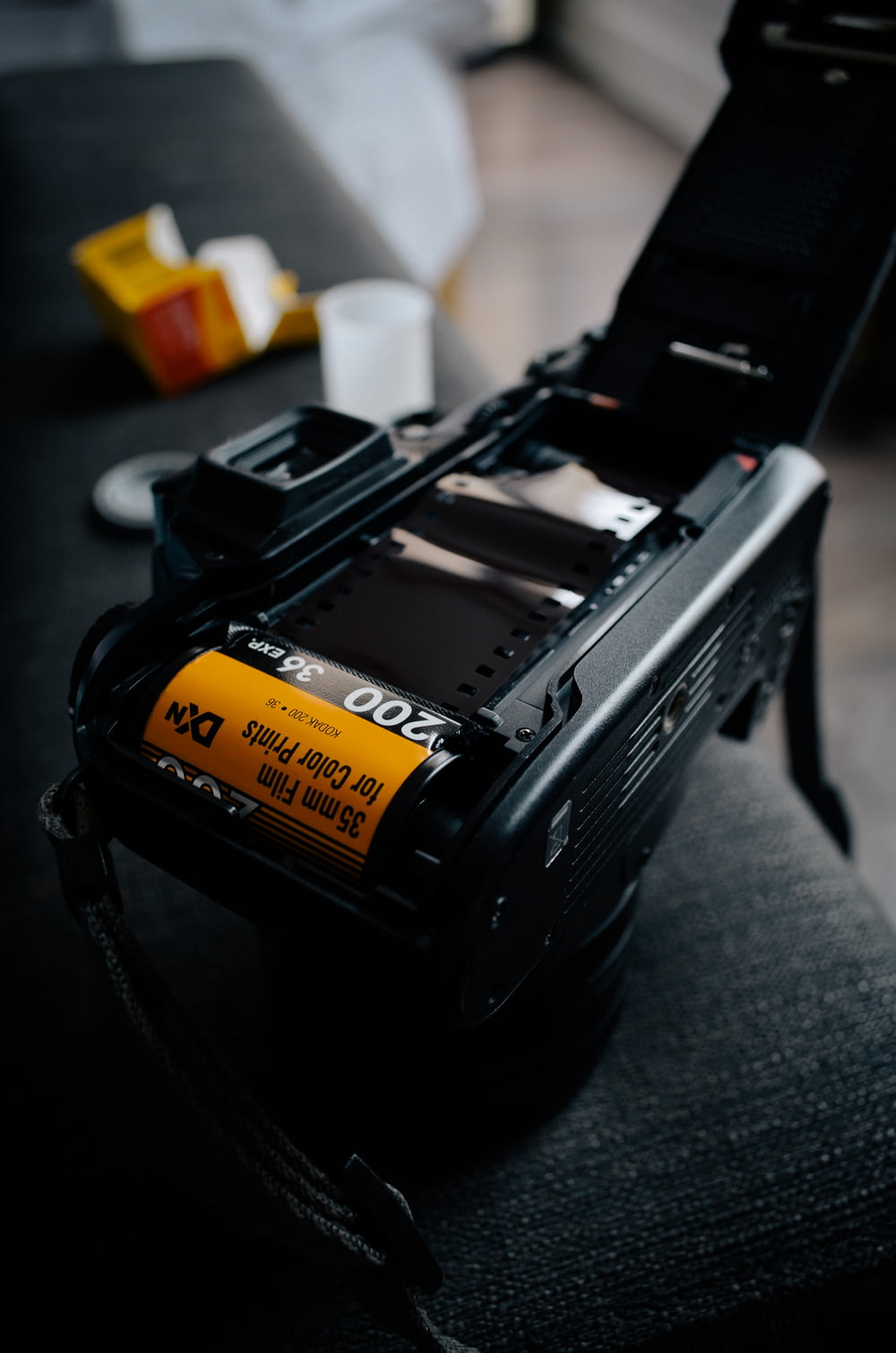 black camera with yellow and black battery