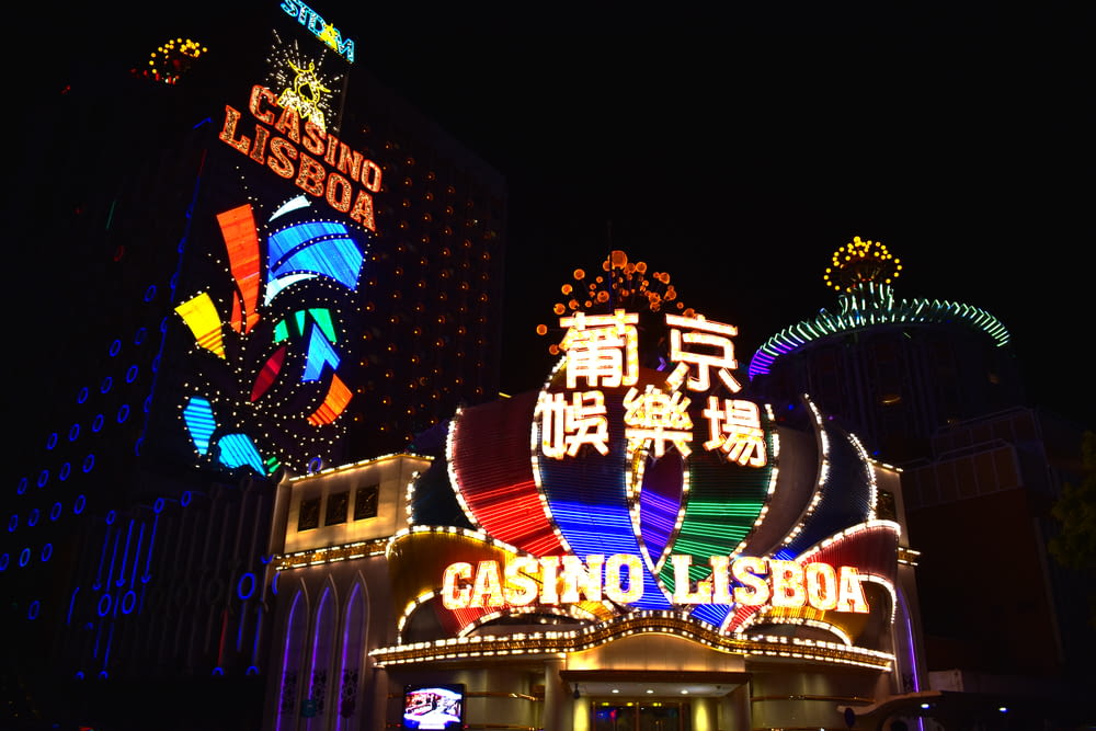 a casino lit up at night with neon signs