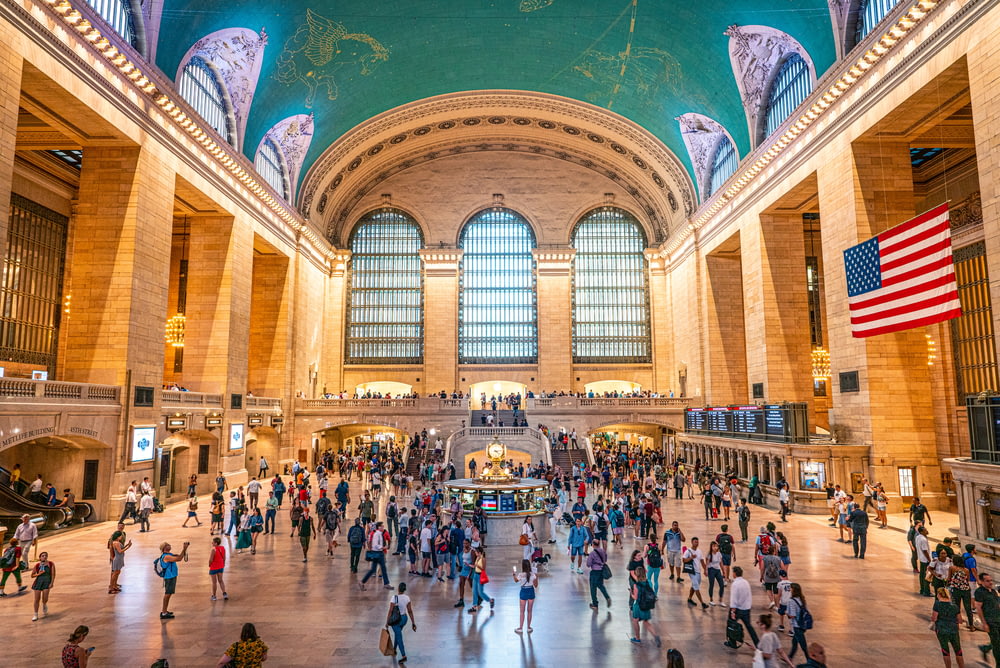 crowd of people walking in Grand Central Terminal