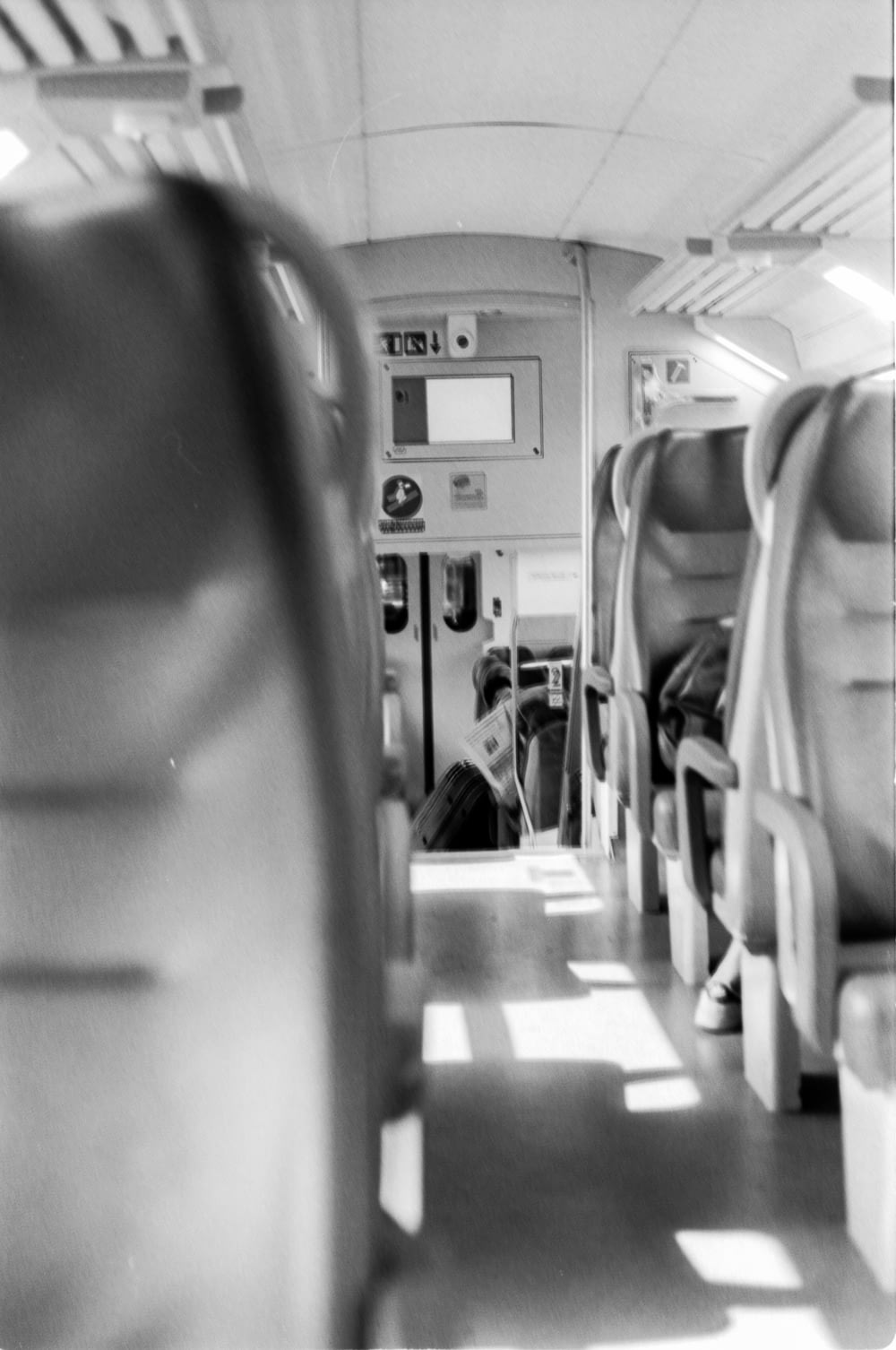 grayscale photography of plane passenger seat