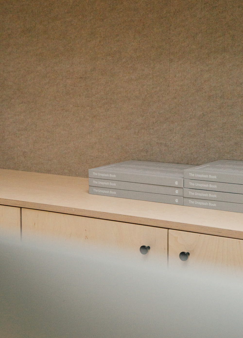 gray boxes on wooden console cabinet