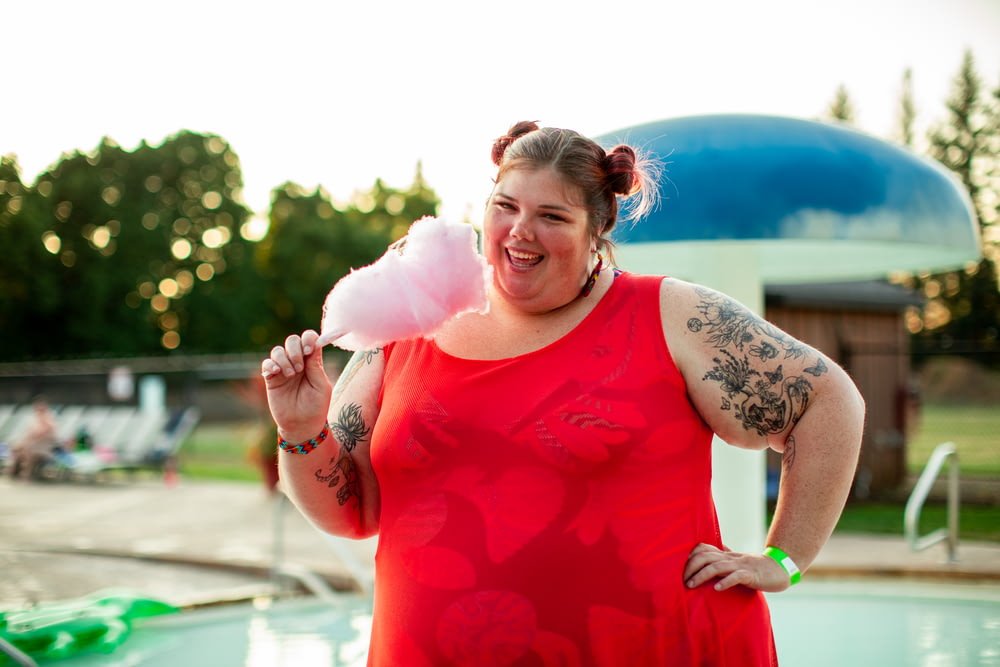 smiling woman holding cotton candy