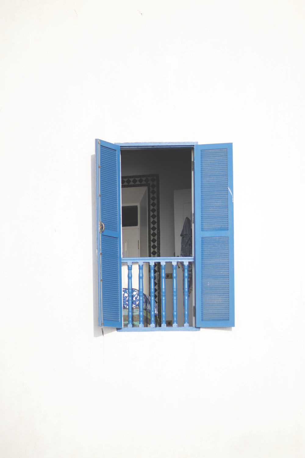 opened blue wooden window