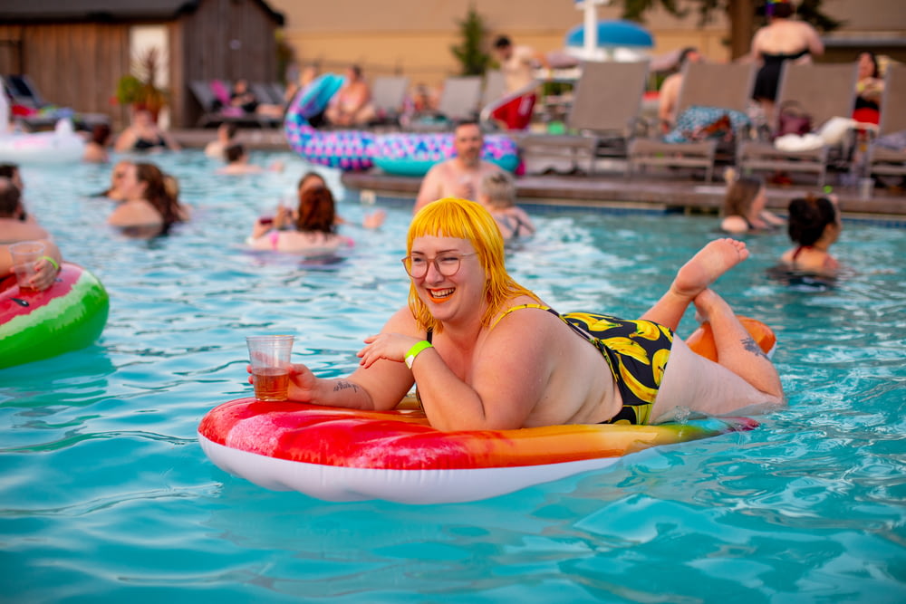 smiling woman on pool float