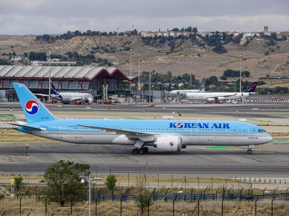 blue Korean Air airplane on runway
