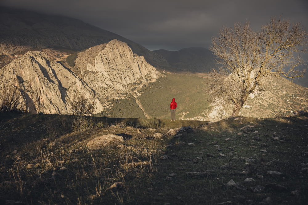 man stands on between mountains
