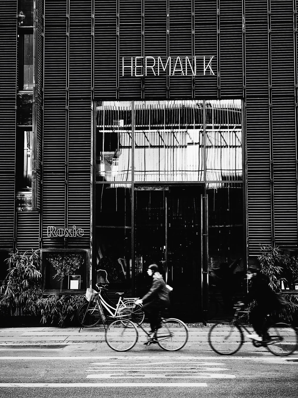 grayscale photography of Herman K shop front