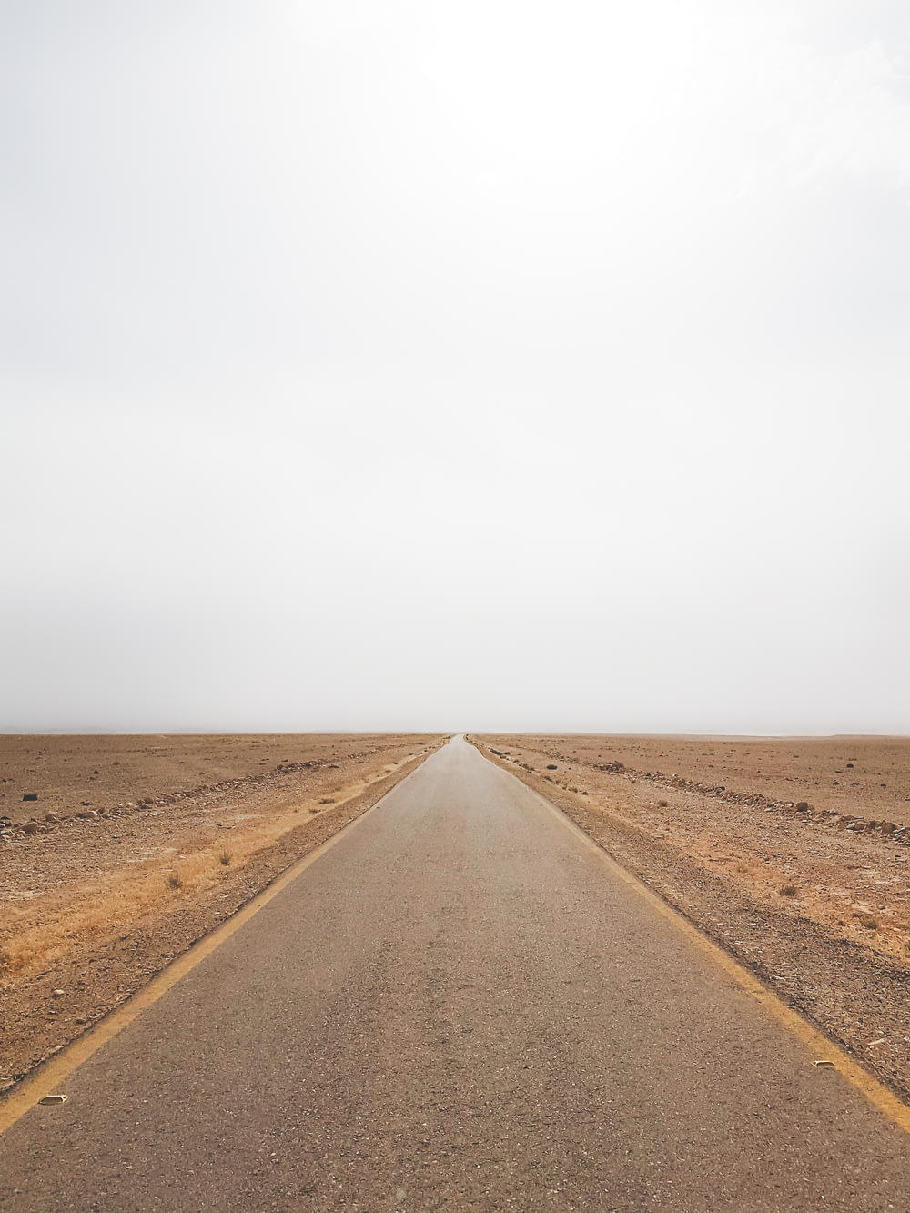 empty road under grey sky