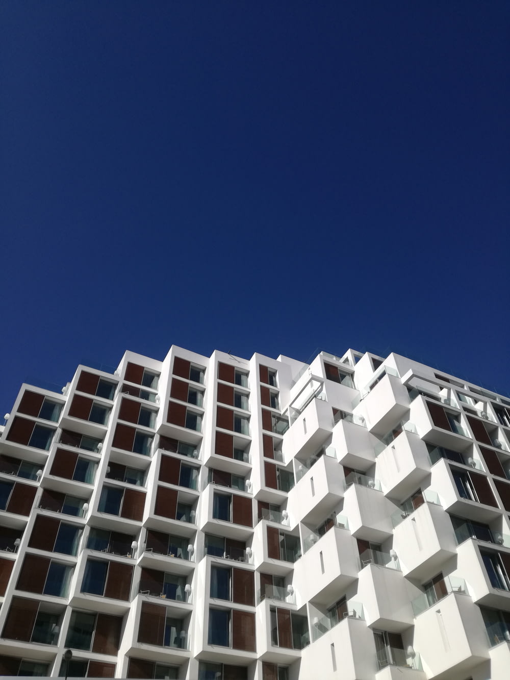 white concrete building under blue sky during daytime