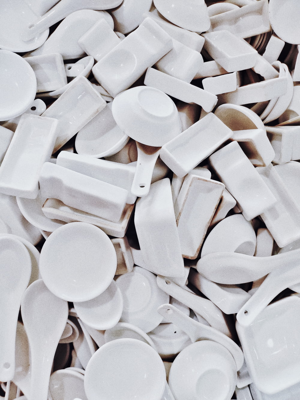 white ceramic bowls and spoons