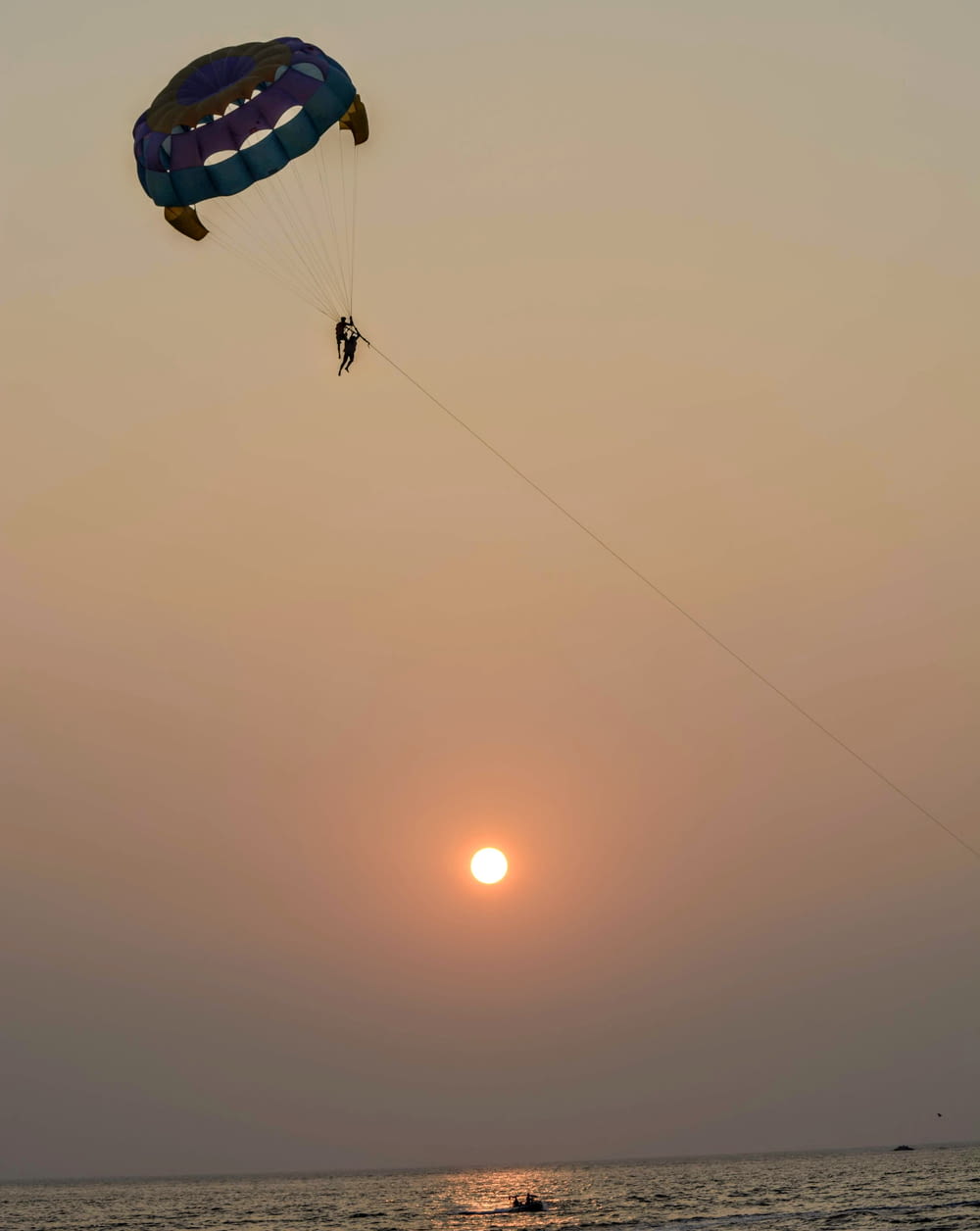 person parasailing over sea water during daytime